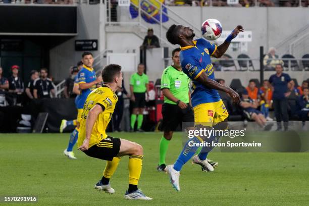 Julian Quinones of America controls the ball while Sean Zawadzki of Columbus Crew defends during the first half of the Leagues Cup group stage match...