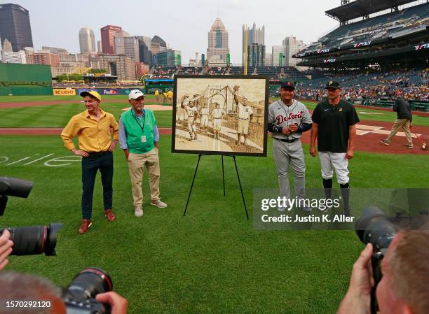 Miguel Cabrera of the Detroit Tigers is honored before the game with a painting against the Pittsburgh Pirates at PNC Park on August 1, 2023 in...