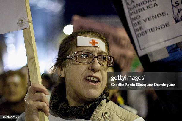 Woman shouts slogans amid other health workers during a demonstration held on the second day of a two day general strike on November 27, 2012 in...