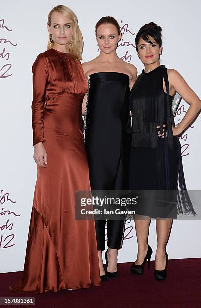Stella McCartney , winner of Designer of the Year poses in the awards room with Amber Valletta and Salma Hayek at the British Fashion Awards 2012 at...