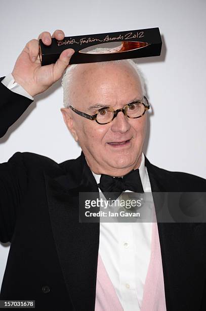 Manolo Blahnik, winner of the Outstanding Achievement in Fashion poses in the awards room at the British Fashion Awards 2012 at The Savoy Hotel on...