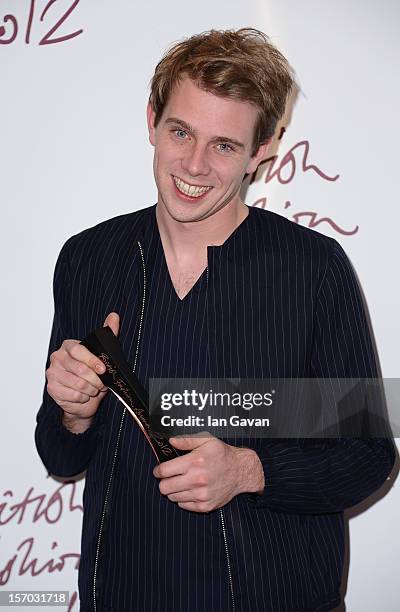 Jonathan Anderson of JW Anderson, winner of the Emerging Talent award, Ready-To-Wear poses in the awards room at the British Fashion Awards 2012 at...