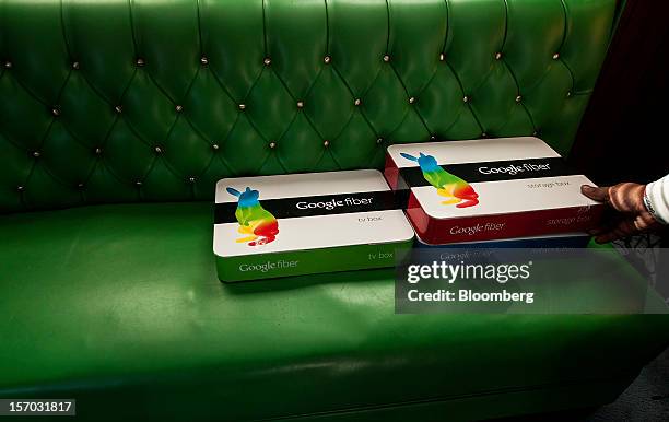Boxes of equipment needed to install Google Fiber broadband network sit on a couch at the home of customer Becki Sherwood in Kansas City, Kansas,...
