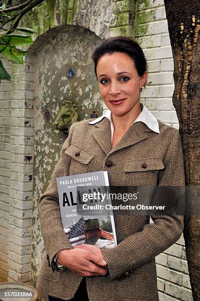 In this January 14, 2012 photo, Paula Broadwell, author of the David Petraeus biography "All In" poses for photos in Charlotte, North Carolina....