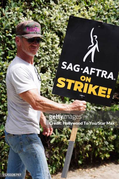 Sean Penn walks the picket line in support of the SAG-AFTRA and WGA strike on August 1, 2023 in Burbank, California.