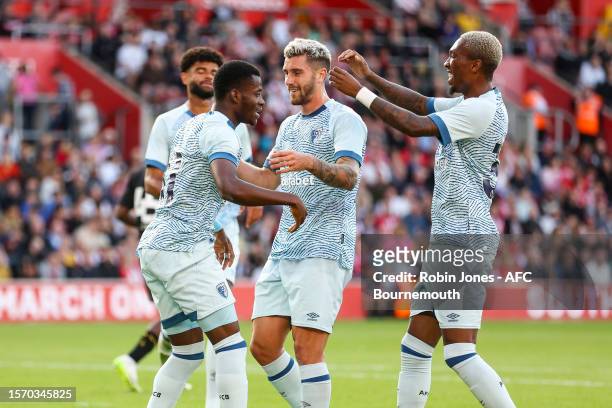 Dango Ouattara of Bournemouth is congratulated by team-mates Marcos Senesi and Jaidon Anthony after he scores a goal to make it 1-0 during pre-season...