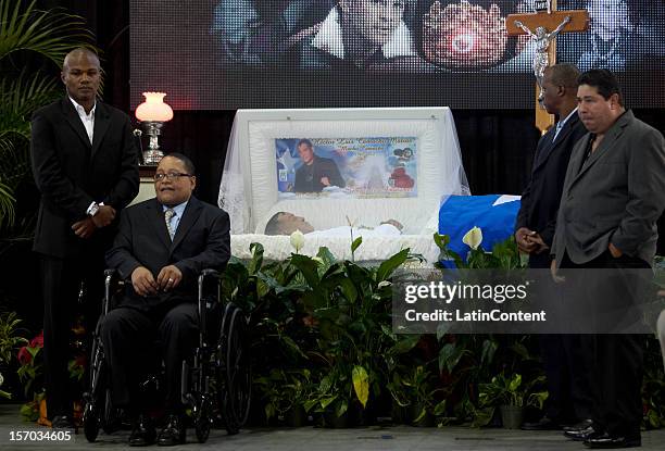 Boxing champion Felix Tito Trinidad, Wilfred Benitez, Alfredo Escalera and Wilfredo Gomez pose with the remains of the deceased during the funeral of...