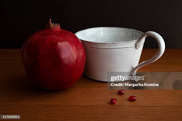 pomegranate fruit, white cup and three arils - pomegranate margarita stock pictures, royalty-free photos & images