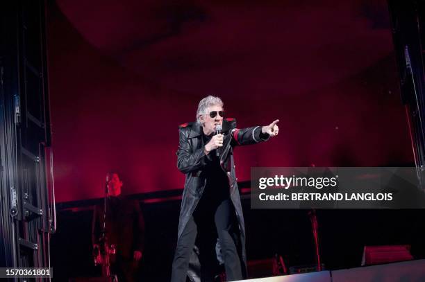 Roger Waters, bassist from the Rock group Pink Floyd, gestures to the crowd during a performance of The Wall at the Bercy POPB concert hall in Paris...