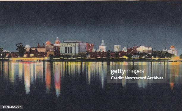 Vintage souvenir linen postcard published circa 1941 in series titled 'Oakland and Berkeley, California' depicting a view of the Oakland city skyline...
