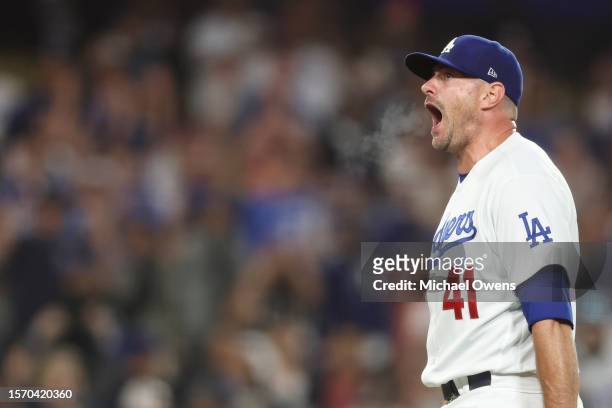 Daniel Hudson of the Los Angeles Dodgers reacts after closing out the ninth inning with bases loaded to defeat the Pittsburgh Pirates, 6-4, at Dodger...