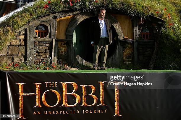 Director Peter Jackson emerges from from a Hobbit house before delivering a speech at the "The Hobbit: An Unexpected Journey" World Premiere at...