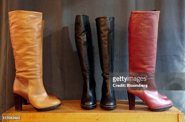 Ladies' boots sit on display inside a NW3 store, a brand of Hobbs and former pop-up store, in London,k U.K., on Tuesday, Nov. 27, 2012. Fashion chain...