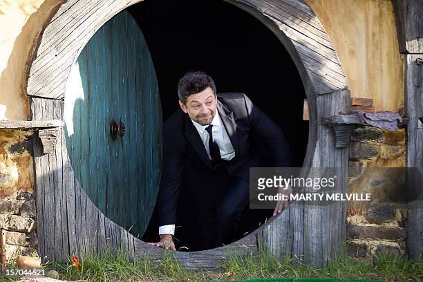 Actor Andy Serkis walks out onto the stage at the world premiere of "The Hobbit" movie in Courtenay Place in Wellington on November 28, 2012. Huge...