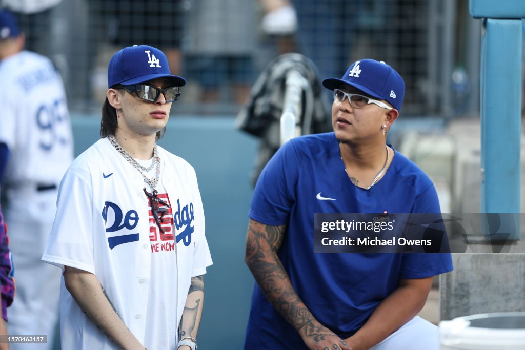 Rapper Peso Pluma chats with Julio Urias of the Los Angeles Dodgers News  Photo - Getty Images