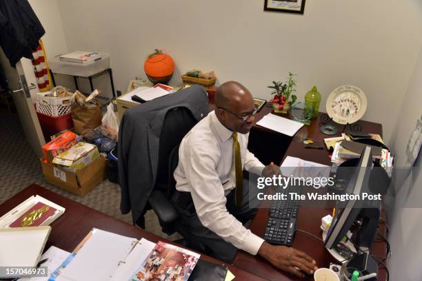 Jean Kabre's office, where he works as a concierge and event planner at 101 Constitution Avenue, houses donations for his home village on Tuesday,...