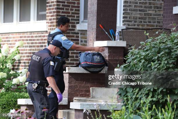 Chicago police officers investigate after a Postal Service mail carrier was shot Aug. 1 in the 3200 block of North Kildare Avenue, in Chicago&apos;s...