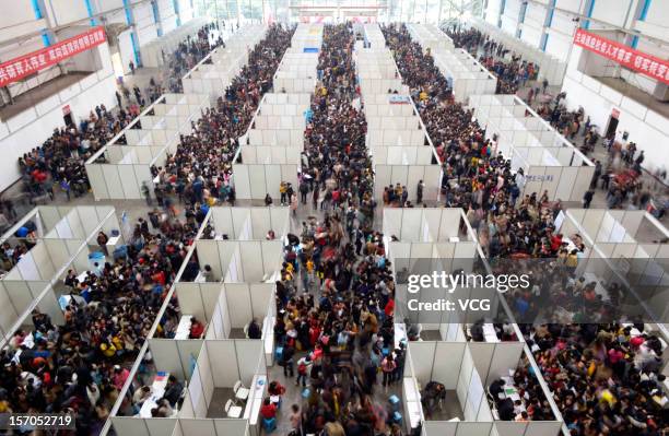 Thousands of students apply for jobs during a job fair for graduates at Chongqing Exhibition Center on November 27, 2012 in Chongqing, China. More...