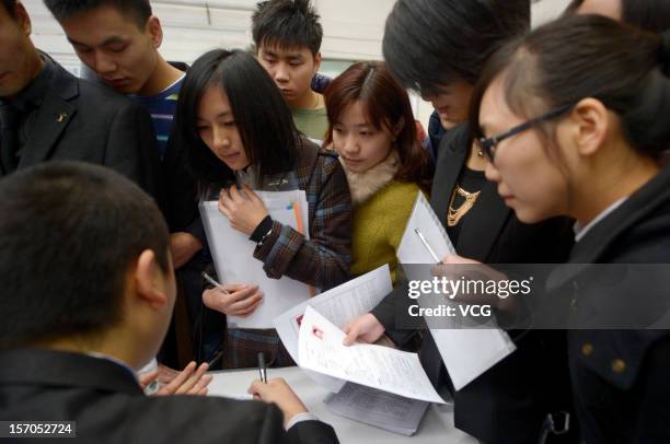 Thousands of students apply for jobs during a job fair for graduates at Chongqing Exhibition Center on November 27, 2012 in Chongqing, China. More...