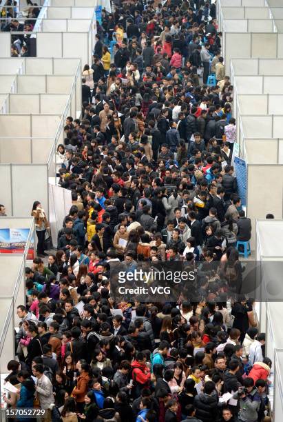 Thousands of students apply for jobs during a job fair for graduates at Chongqing Exhibition Center on November 27, 2012 in Chongqing, China. More...