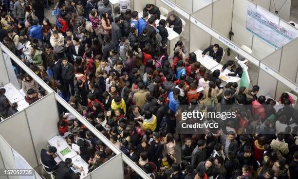 Thousands of students apply for jobs during a job fair for graduates at Chongqing Exhibition Center on November 27, 2012 in Chongqing, China. More...