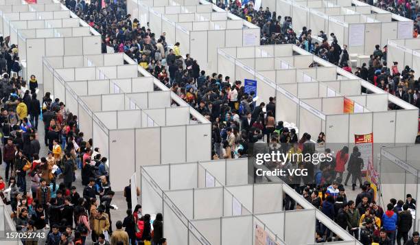 Thousands of students apply for jobs during a job fair for graduates at Chongqing Exhibition Center on November 27, 2012 in Chongqing, China. More...