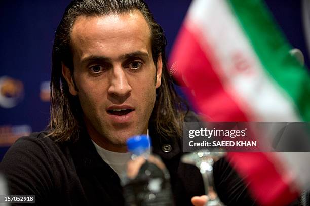 Mohammad Ali Karimi, a nominee of AFC Player Of The Year, speaks at a press conference in Kuala Lumpur on November 28, 2012. Asian Football...