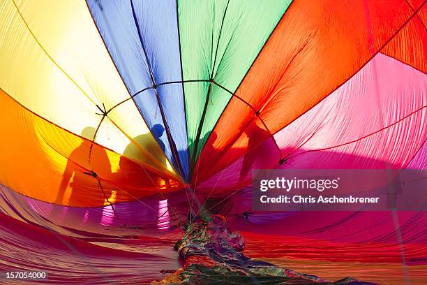 silhouettes inside a hot air  balloon 6765 - reno stock pictures, royalty-free photos & images