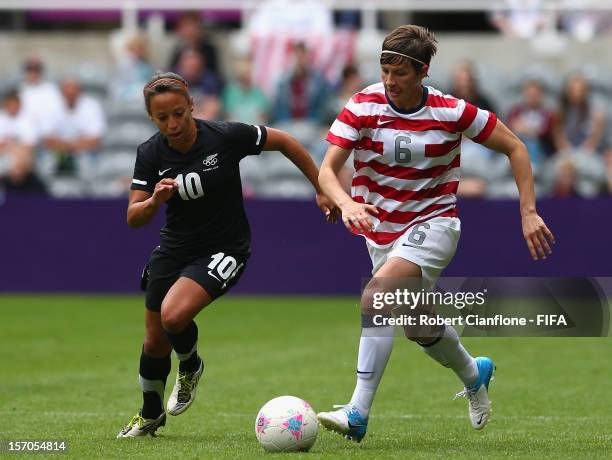 Amy Le Peilbet of the USA is chased by Sarah Gregorius of New Zealand during the Women's Football Quarter Final match between United States and New...
