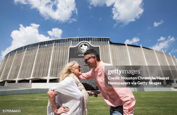 Dene Hofheinz, daughter of Judge Roy Hofheinz, embraces her son, Dinn Mann, following the dedication of a Texas State Historical Marker, honoring the...