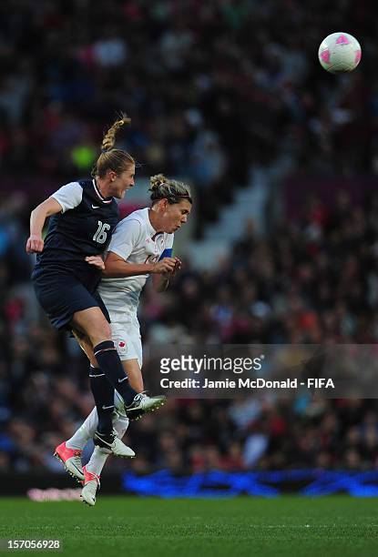 Christine Sinclaire of Canada battles with Rachel Buehler of USA during the Women's Football Semi Final match between Canada and USA, on Day 10 of...
