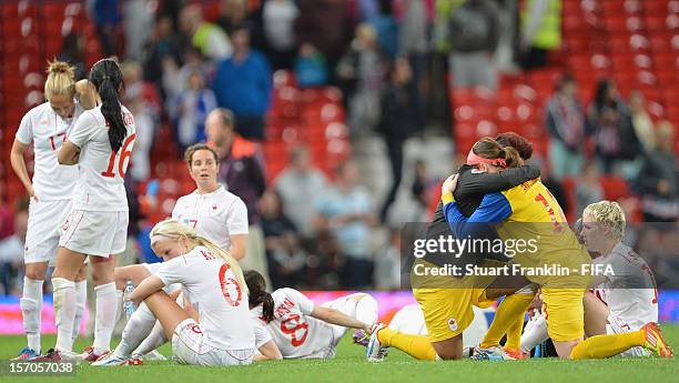 The players of Canada look dejected at the end of the Women's Football Semi Final match between Canada and USA, on Day 10 of the London 2012 Olympic...