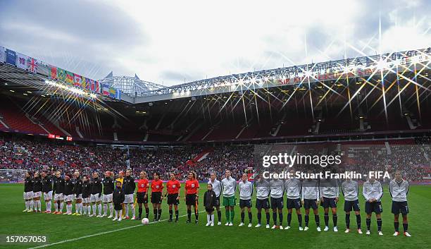 The teams line up at the start of the Women's Football Semi Final match between Canada and USA, on Day 10 of the London 2012 Olympic Games at Old...