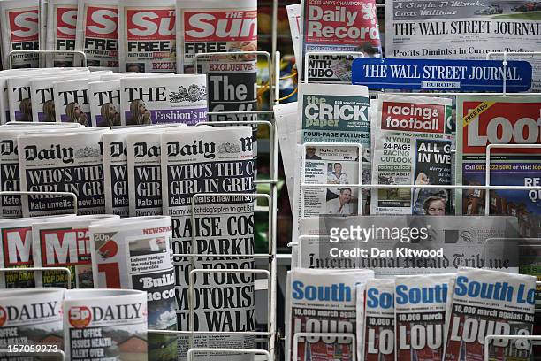 Newspapers are displayed on a stand outside a newsagent on November 28, 2012 in London, England. The findings of the Leveson Inquiry which focused on...