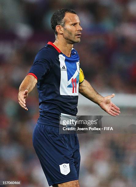 Ryan Giggs of Great Britain gestures during the Men's Football first round Group A Match of the London 2012 Olympic Games between Great Britain and...