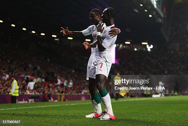 Moussa Konate of Senegal celebrates with his team mate after scoring his team's first goal during the Men's Football first round Group A Match of the...