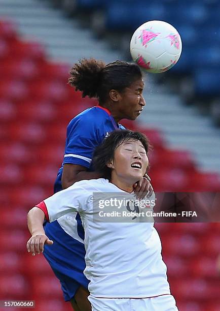 Eugenie Le Sommer of France heads the ball over the top of Mi Gyong Choe of Korea DPR during the Women's Football first round Group G Match of the...