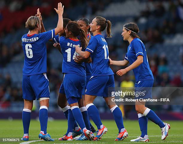 Laura Georges of France celebrates her goal with teammates during the Women's Football first round Group G Match of the London 2012 Olympic Games...
