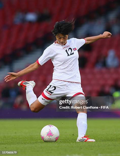 Un Hyang Kim of Korea DPR kicks the ball during the Women's Football first round Group G Match of the London 2012 Olympic Games between France and...