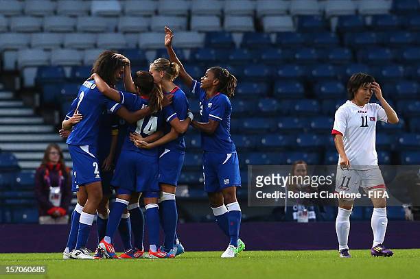 Wendie Renard of France celebrates her goal with teammates during the Women's Football first round Group G Match of the London 2012 Olympic Games...