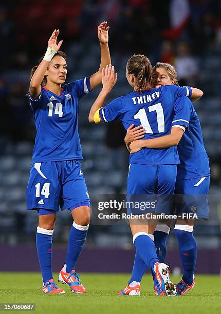 The French team celebrate after they defeated Korea DPR at the Women's Football first round Group G Match of the London 2012 Olympic Games between...