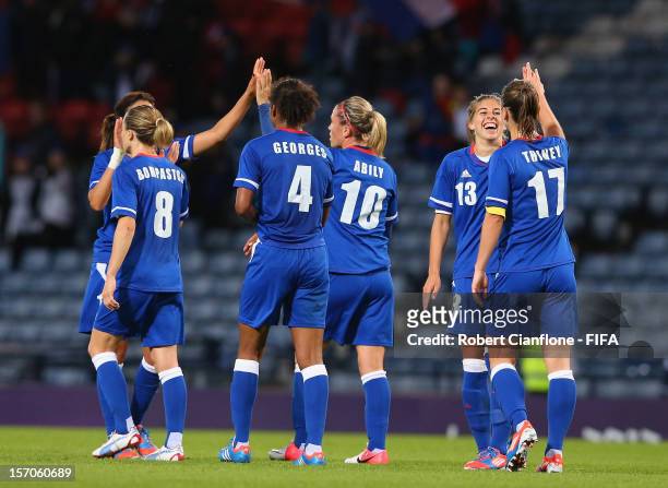 The French team celebrate after they defeated Korea DPR at the Women's Football first round Group G Match of the London 2012 Olympic Games between...