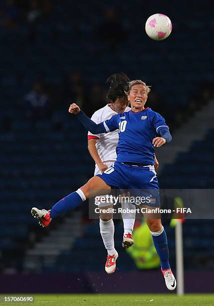 Camille Abily of France heads the ball during the Women's Football first round Group G Match of the London 2012 Olympic Games between France and...