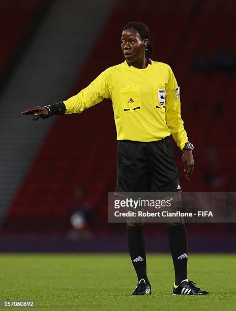Referee Therese Neguel gestures during the Women's Football first round Group G Match of the London 2012 Olympic Games between France and Korea DPR...