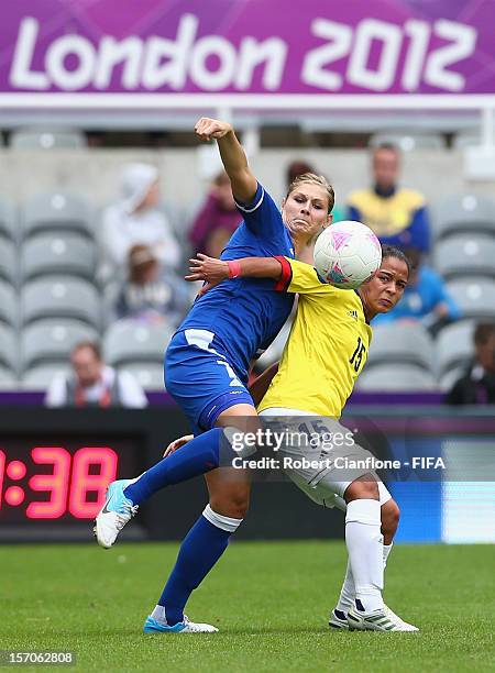 Corine Franco of France challenges Ingrid Vidal of Colombia during the Women's Football first round Group G match between France and Colombia on Day...