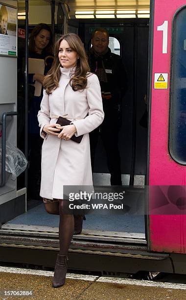 Catherine, Duchess of Cambridge arrives at Cambridge station to pay an official visit to Cambridge with Prince William, Duke of Cambridge on November...