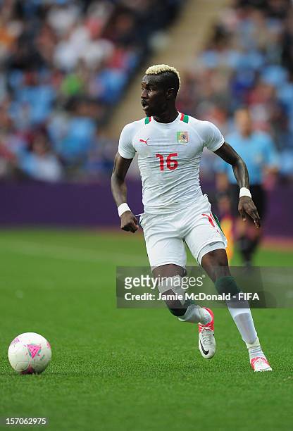 Pape Souare of Senegal battles in action during the Men's Football first round Group A Match between Senegal and United Arab Emirates, on Day 5 of...