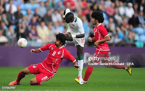 Sadio Mane of Senegal battles with Hamdan Al Kamali of United Arab Emirates during the Men's Football first round Group A Match between Senegal and...