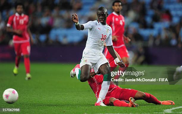 Sadio Mane of Senegal battles with Hamdan Al Kamali of United Arab Emirates during the Men's Football first round Group A Match between Senegal and...