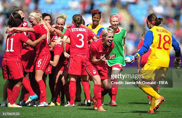 Sophie Schmidt and Erin McLeod of Canada celebrate Bronze during the Women's Football Bronze Medal match between Canada and France, on Day 13 of the...